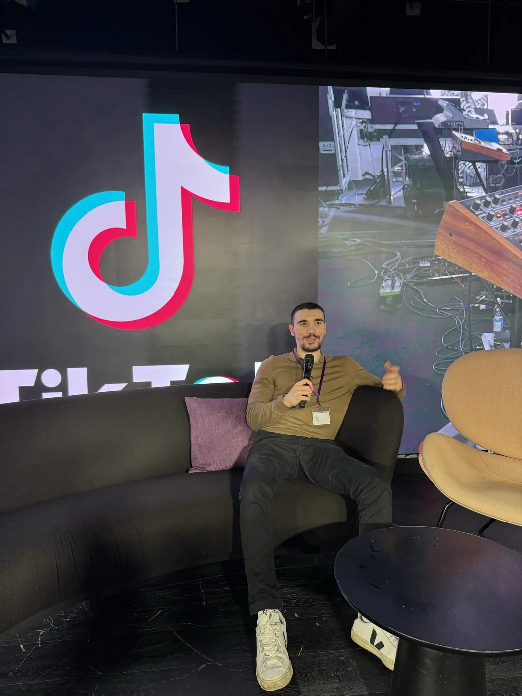 Deniz Sancar speaking on stage at TikTok